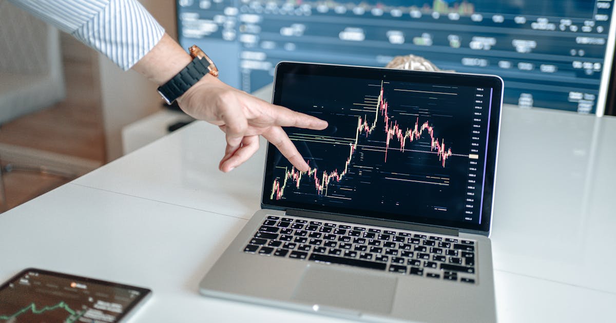 Investor reviewing a portfolio diversification plan on a laptop