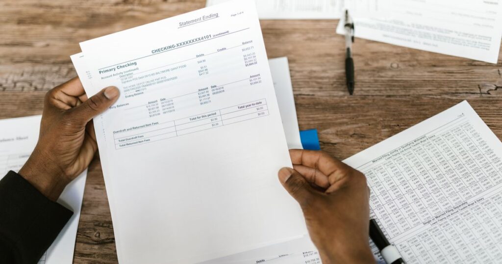 Reviewing tax loss harvesting paperwork at a desk